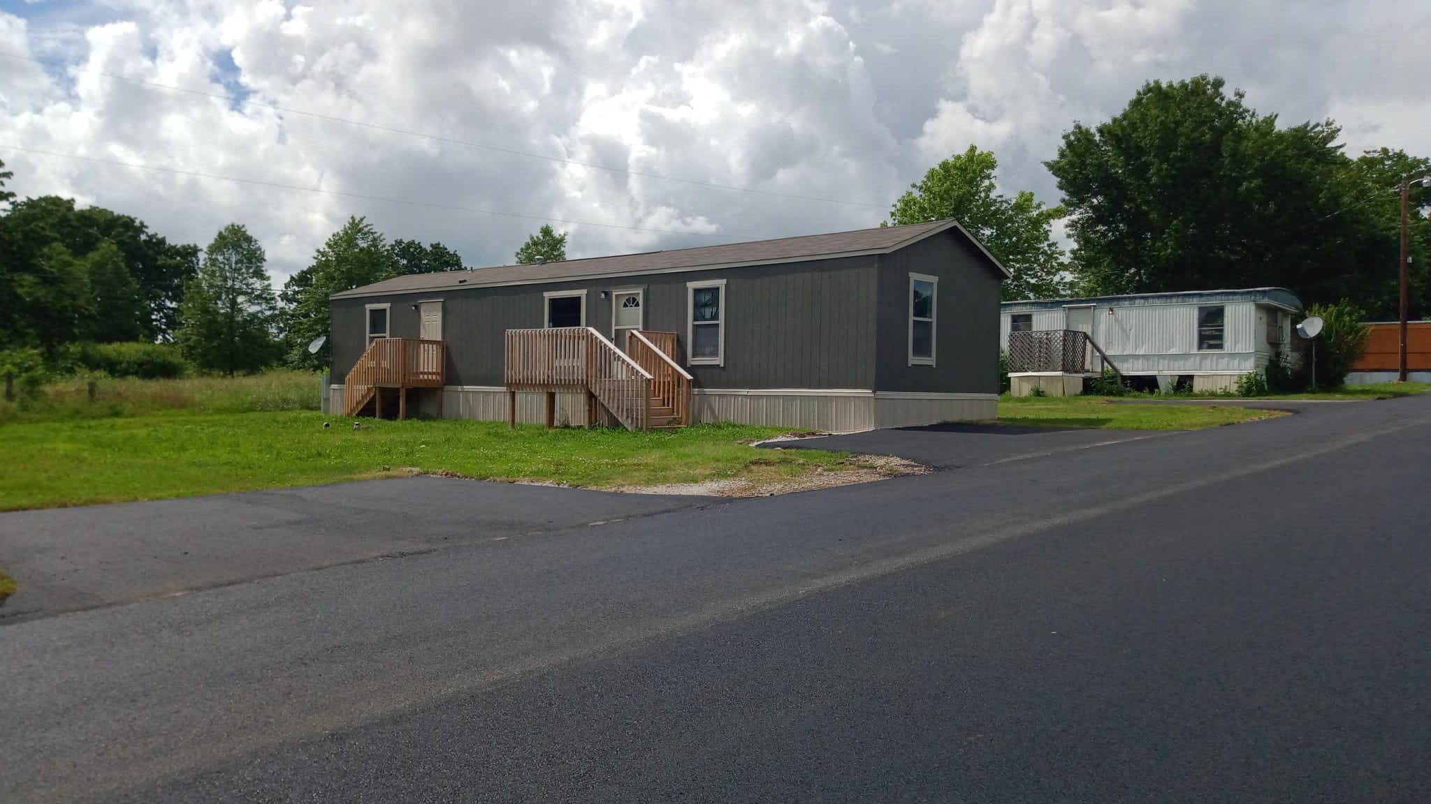 a mobile home sits on the side of a road